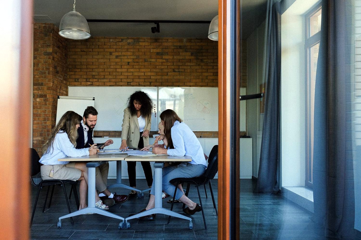 A leadership team reviewing performance in a boardroom