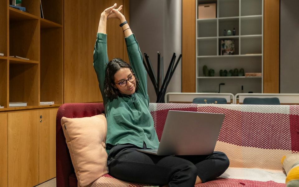 A founder working through the numbers from the office couch